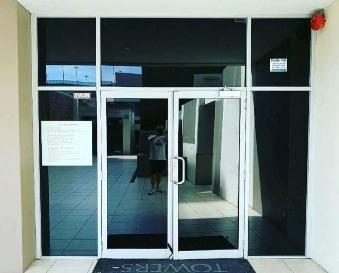 Apartment compmex front entryway tinted to reduce heat and glare making it also more private for residents sleek modern affordable solution to improve exterior asthetics of the property adding value to the property without breaking the bank extremly low maintenance servicing all sydney, wollongong, canberra business district areas